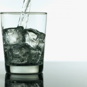 Image of Vodka Pouring in Rocks Glass for Industry Benchmarks for Liquor Costs in Restaurants