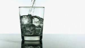 Image of Vodka Pouring in Rocks Glass for Industry Benchmarks for Liquor Costs in Restaurants
