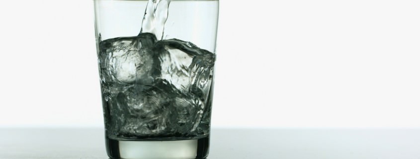 Image of Vodka Pouring in Rocks Glass for Industry Benchmarks for Liquor Costs in Restaurants